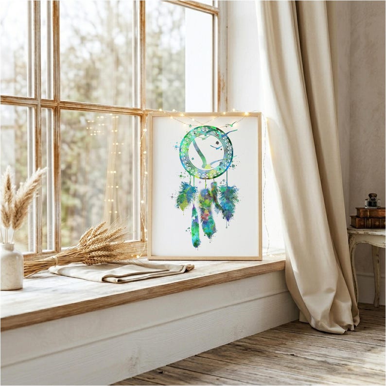 A vibrant watercolor print of a traditional bohemian dreamcatcher featuring intricate geometric weaving and a cascade of colorful, richly textured feathers.