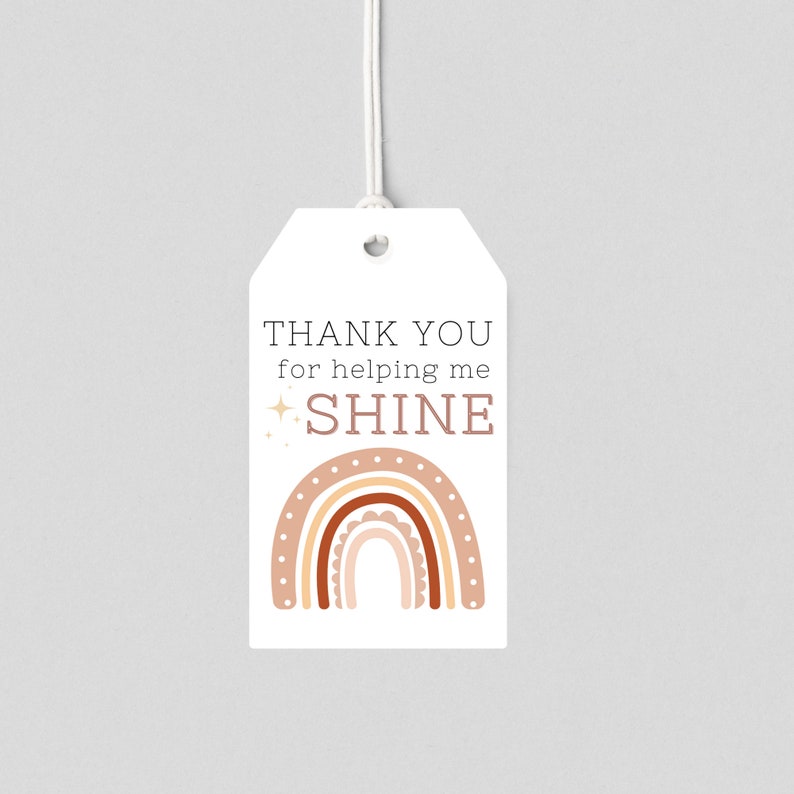 May include: A white thank you tag with a brown and pink rainbow and the text "THANK YOU for helping me SHINE".