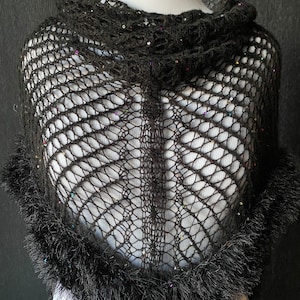 May include: Black crochet shawl with a fuzzy trim and iridescent sequins.
