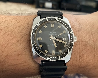 Vintage 1969 Belair Seapearl 600 Caliber 1551 Diver Calendar Date Men's Watch with a Stainless Steel Black Kreisler DuraFlex Band