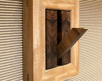 Wood wall hook with decorative frame. Designed and made by Hecho en Casa - Taller