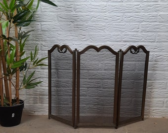 Antic style brass Firewall for a fireplace