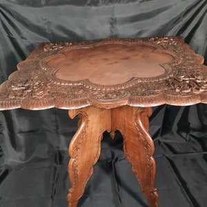 Very unique Antique folding table with fine carvings, Surinamese