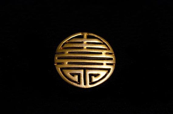 Ancient motive TBM sighed Chunky gold tone broch. - image 1