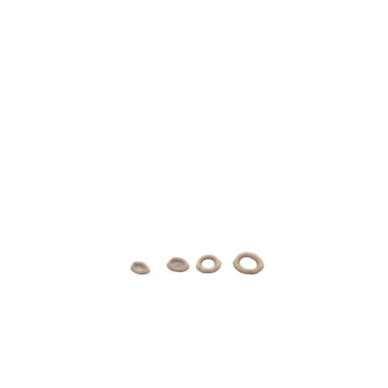 May include: Four beige rubber rings of different sizes, arranged in a row from smallest to largest.