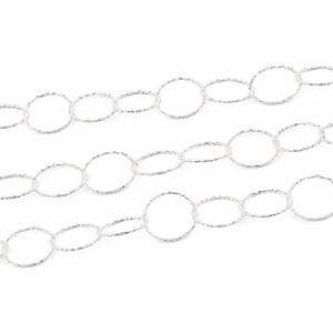 May include: A silver chain necklace featuring a series of interconnected circular links. Each individual link has a textured, shimmering surface that catches the light, creating a continuous, repeating pattern across the length of the jewelry piece.