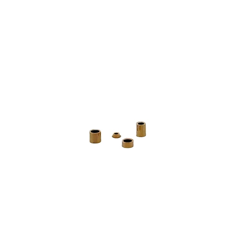 May include: Four gold-colored metal rings of different sizes. The rings are round and have a smooth surface.