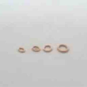 May include: Five gold jump rings of different sizes, arranged in a row from smallest to largest.