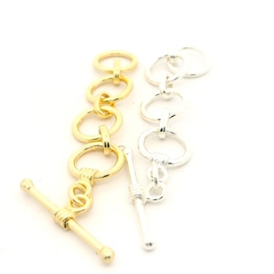 A Pack of 5 pieces of Adjustable Toggles, E-Coated, Designer's Adjustable Toggles, Available  2 Colors Gold finish and Silver Plated.