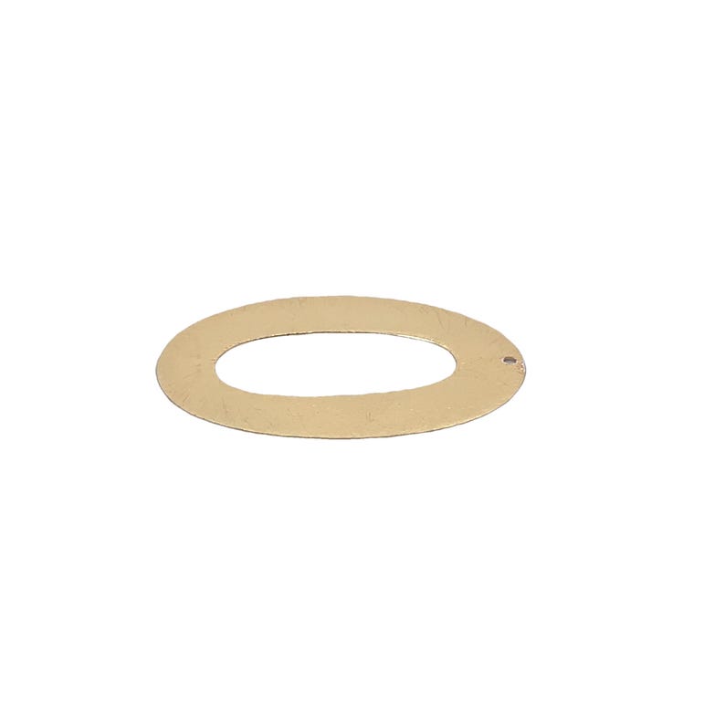May include: A gold-colored metal oval ring with a small hole in the top. The ring is smooth and has a slightly textured surface.