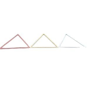 May include: Three triangle-shaped metal hoops in different colors: rose gold, gold, and silver.