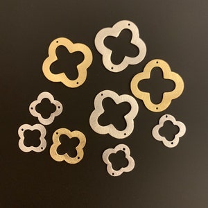 Quatrefoil, Four Leaf Clover Flower 8 to 30 pcs , 2 hole  Gold Finish, And Silver Plated E-Coated, Brushed Findings in 5 sizes .