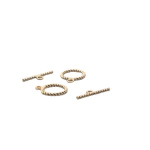 May include: Four gold-toned metal toggle clasps with a twisted rope design. Two are bar-shaped and two are circular.