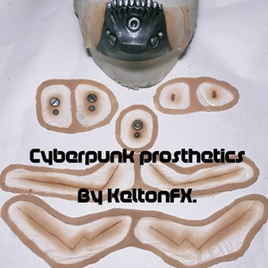 May include: A set of cyberpunk prosthetic makeup pieces for a costume or special effects project. The set includes a mouth piece, two cheek pieces, two eyebrow pieces, and two pieces for the neck. The pieces are made of a flexible material and are designed to be applied to the skin.