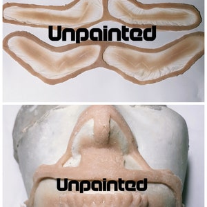 May include: Unpainted prosthetic makeup pieces for a mouth and nose. The pieces are made of a flexible material and are designed to be applied to the face. The pieces are shown in two images: one with the pieces laid out flat and one with the pieces applied to a face.