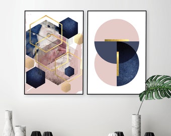 May include: Two abstract geometric prints in a pink and blue colour scheme. The first print features a geometric pattern of gold hexagons and blue and pink shapes. The second print features a pink circle with a blue circle inside, and a gold line across the centre.