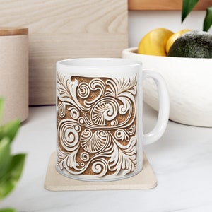 May include: White ceramic mug with a brown and white floral design. The design features intricate swirls and patterns.