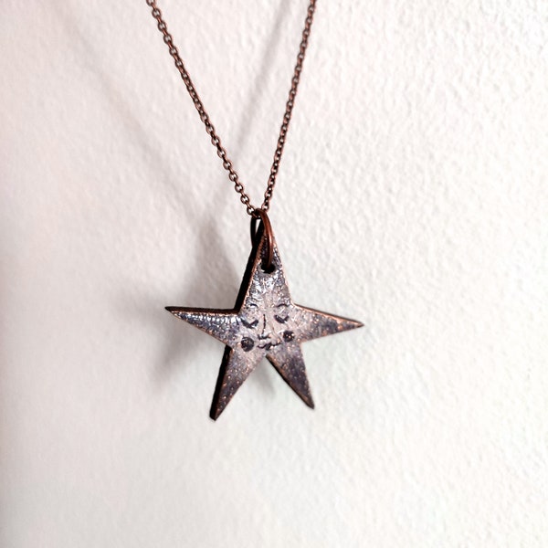 Sepia & Gold Star Pendant Necklace. Laser-cut wooden star with decoupage face and gold speckles. Hung on a delicate brass chain