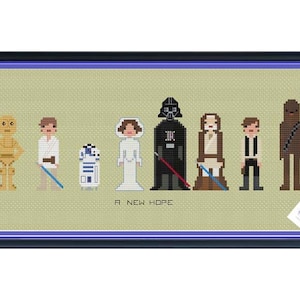 Pode incluir: Um padrão de ponto cruz com personagens de Star Wars: Uma nova esperança. Os personagens incluem Luke Skywalker, a princesa Leia, Han Solo, Chewbacca, Darth Vader, C-3PO, R2-D2 e Obi-Wan Kenobi.