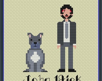 Peut inclure: Broderie au point de croix représentant John Wick et son chien, encadrée d'un cadre bleu foncé. Les personnages sont rendus en style pixelisé, utilisant des nuances de gris, de noir et de rouge. Le texte "John Wick" est brodé en bas.