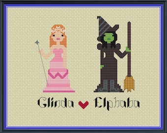 Peut inclure: Modèle de point de croix représentant Glinda et Elphaba de la comédie musicale Wicked. Le motif montre Glinda dans une robe rose et Elphaba dans un chapeau vert et une robe noire.