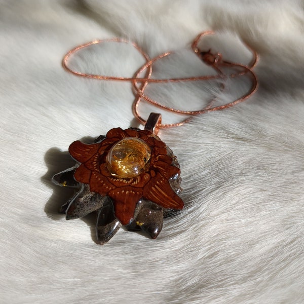 Rutilated Quartz inlayed in Pinecone