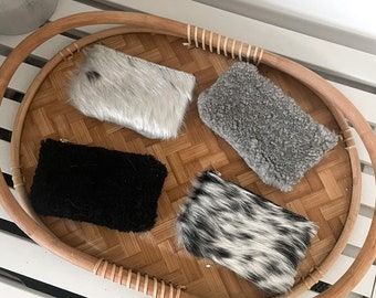 Fluffy leather pouches in shearling and hair on hide. Use as wallets, coin purses, card holder, key holder pouch, lipstick holder.