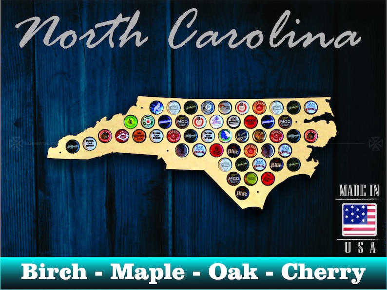 May include: A wooden cutout of the state of North Carolina, designed to hold bottle caps. The cutout is made of birch, maple, oak, or cherry wood. The cutout is displayed on a blue wooden background. The text "North Carolina" is written above the cutout. The text "MADE IN USA" is written below the cutout, with a small American flag image next to it.