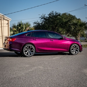 BMW in a crazy colorshift called Ceres Megashift. Such nice a nice purple to magenta mica pigment. Used in car paint liquid car wrap