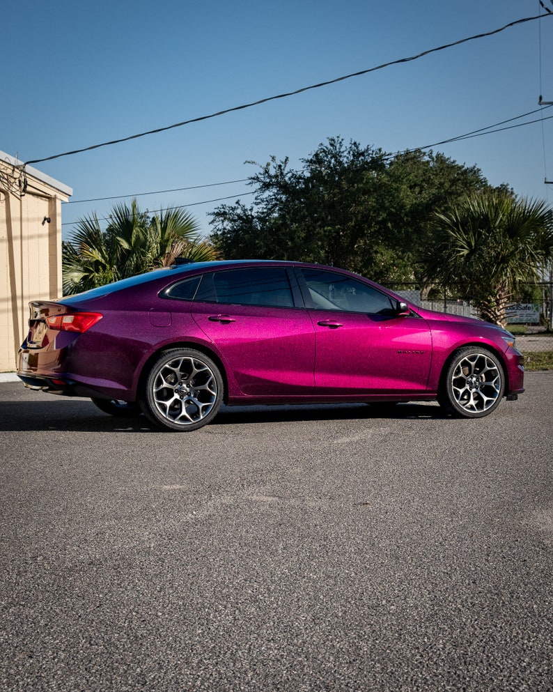 BMW in a crazy colorshift called Ceres Megashift. Such nice a nice purple to magenta mica pigment. Used in car paint liquid car wrap