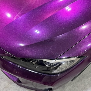 BMW in a crazy colorshift called Ceres Megashift. Such nice a nice purple to magenta mica pigment. Used in car paint liquid car wrap