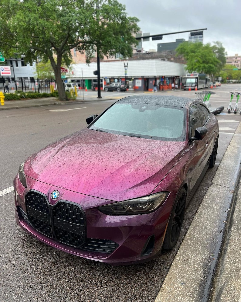 BMW in a crazy colorshift called Ceres Megashift. Such nice a nice purple to magenta mica pigment. Used in car paint liquid car wrap