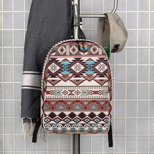 May include: A brown, red, and blue patterned backpack with geometric designs. The backpack has adjustable straps and a zipper closure.