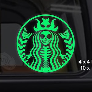 May include: A green glow-in-the-dark sticker of a skeleton mermaid with a crown, in the style of the Starbucks logo. The sticker is 4 x 4 inches (10 x 10 cm).