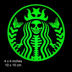 May include: Green glow-in-the-dark sticker of a skeleton mermaid with a crown, resembling the Starbucks logo. The sticker is 4 inches by 4 inches.