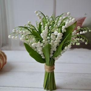 bouquet of lilies of the valley pink and white