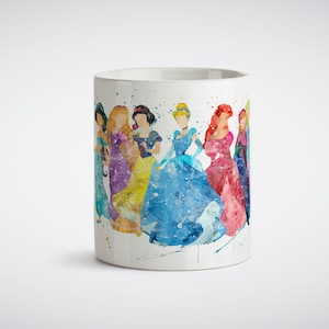 May include: White ceramic mug with a watercolor illustration of seven Disney princesses in their iconic dresses. The princesses are arranged in a line, with Cinderella in the center. The background is a light blue watercolor wash.