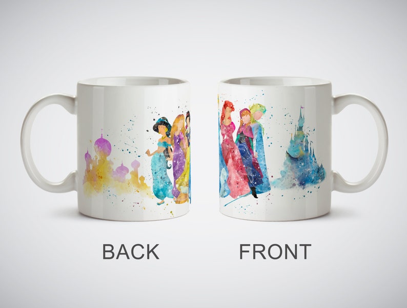 May include: White ceramic mug with a watercolor design of Disney princesses on the front and a watercolor design of a castle on the back.