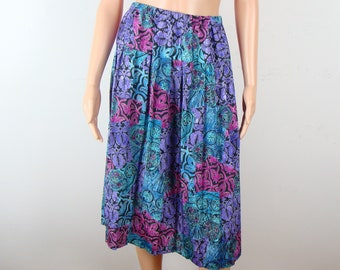 May include: A purple, blue, and pink patterned midi skirt with a high waist.