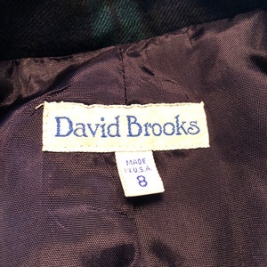 Op de afbeelding: Een zwart en groen geruit jack met een zwarte voering. Het label vermeldt "David Brooks" en "Made in U.S.A." met maat 8.