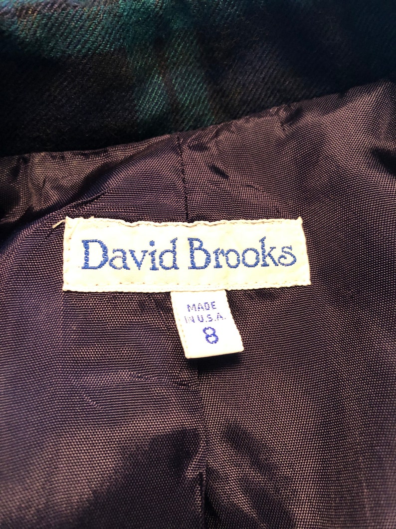 Op de afbeelding: Een zwart en groen geruit jack met een zwarte voering. Het label vermeldt "David Brooks" en "Made in U.S.A." met maat 8.