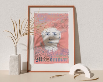 May include: A framed print with a pink background and a line drawing of a person's face surrounded by flowers. The text "Midsommar" is at the bottom of the print.