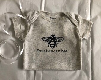 baby clothes with bees