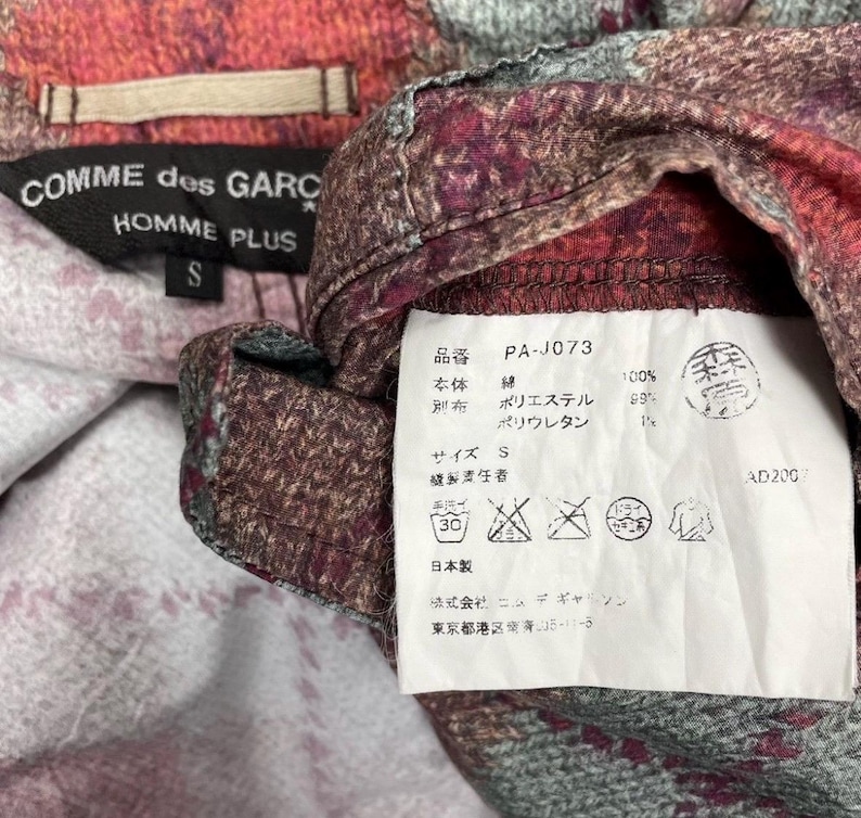 May include: A handmade wooden sign with the text "Welcome to our home" in a handwritten style. The sign is painted white with black lettering and a distressed finish, ideal for home decor.