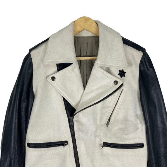 abrigo con manga de cuero