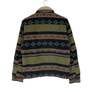 May include: A green, black and brown patterned fleece jacket with a zip closure. The jacket has a southwestern style design.