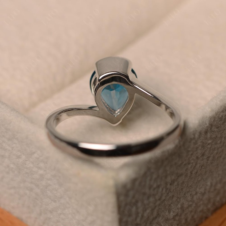 London blue topaz ring, pear cut blue gemstone, sterling silver finished with rhodium, engagement ring, solitaire ring image 3