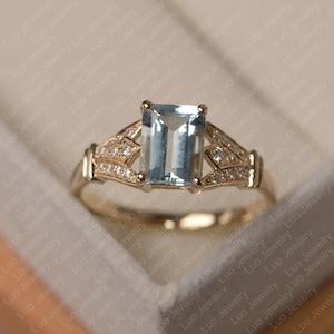 Aquamarine ring, emerald cut March birthstone, yellow gold engagement ring