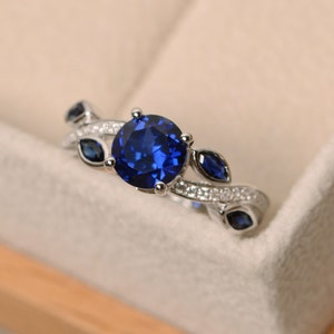 Sapphire wedding ring, olive branch leaves ring, round shaped blue stone, September birthstone