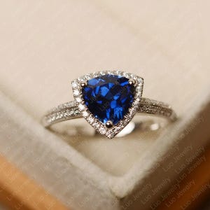 Blue sapphire ring, trillion cut, sterling silver, halo engagement ring, September birthstone